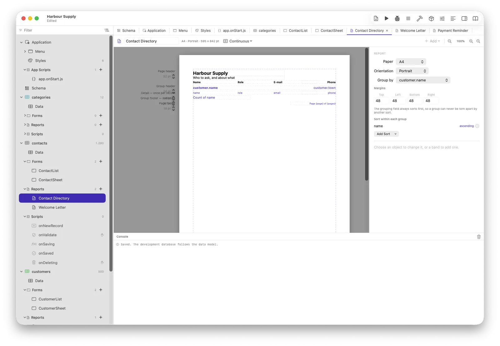 The report editor: bands down the left, the page in the middle, grouping on the right